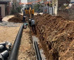 Workers laying underground water pipelines in Jhunjhunu under Yamuna project, June 2025