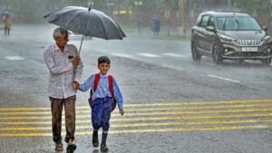 Traffic volunteer guiding students across road near Jhunjhunu school during safety drive