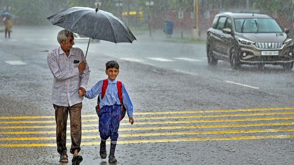 Traffic volunteer guiding students across road near Jhunjhunu school during safety drive